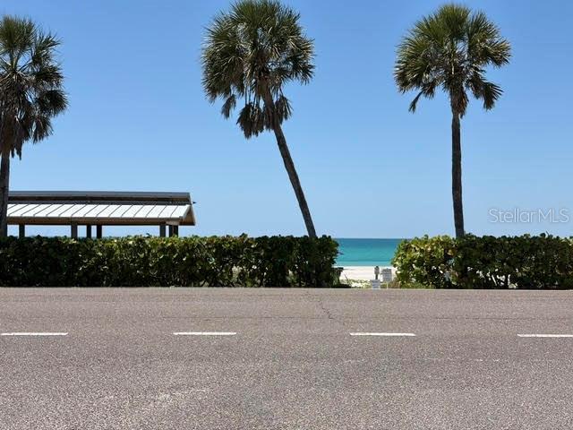 581 Rountree Drive Longboat Key, FL 34228 - Photo 16 of 50 a view of street with tall trees