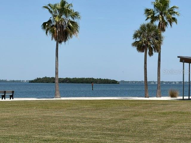 581 Rountree Drive Longboat Key, FL 34228 - Photo 29 of 50 a view of a swimming pool and a yard