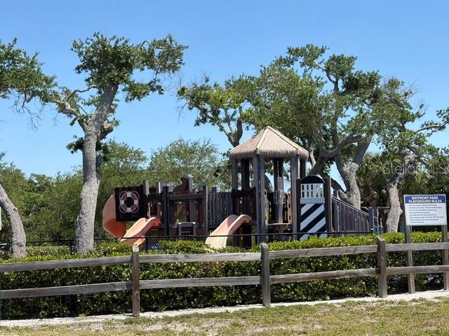 581 Rountree Drive Longboat Key, FL 34228 - Photo 37 of 50 a front view of a house with a yard and potted plants