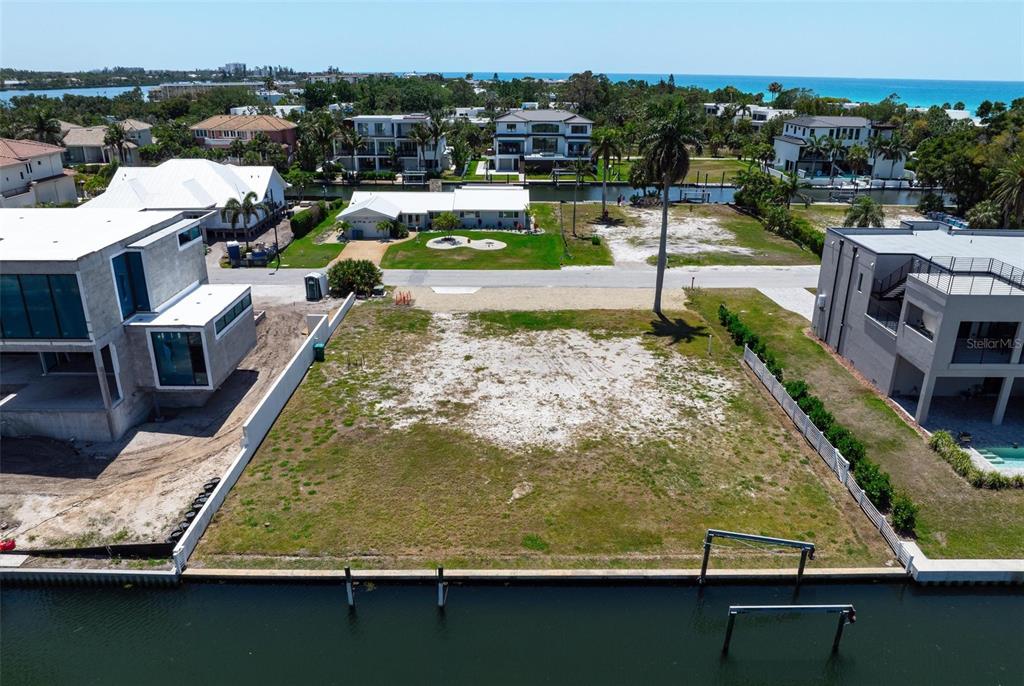 581 Rountree Drive Longboat Key, FL 34228 - Photo 10 of 50 a view of a swimming pool with lounge chairs