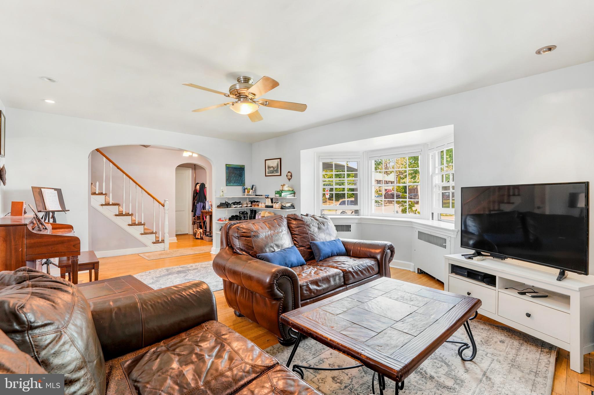 284 Trent Road Wynnewood, PA 19096 - Photo 7 of 31 a living room with furniture a flat screen tv and a window