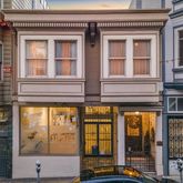 a view of a building with a window and balcony