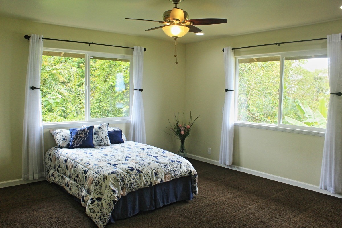 18-1354 Nichols Rd Mountain View Mountain View, HI 96771 - Photo 12 of 30 a bedroom with a large bed and a window
