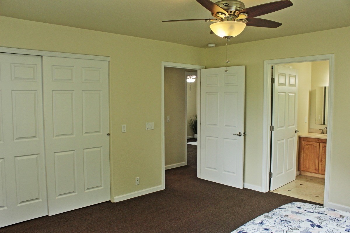 18-1354 Nichols Rd Mountain View Mountain View, HI 96771 - Photo 13 of 30 a view of a room with a chandelier fan and closet