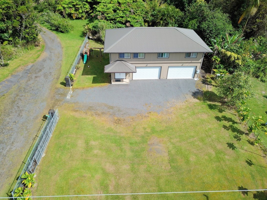 18-1354 Nichols Rd Mountain View Mountain View, HI 96771 - Photo 2 of 30 a aerial view of a house with swimming pool