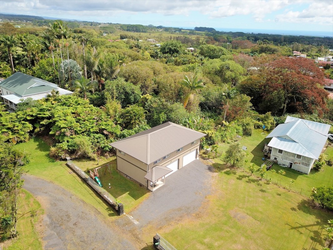 18-1354 Nichols Rd Mountain View Mountain View, HI 96771 - Photo 25 of 30 an aerial view of a house with a yard