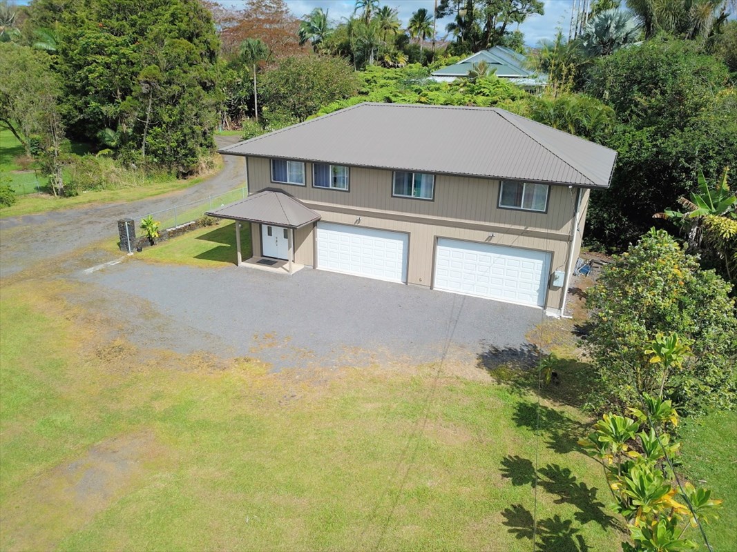 18-1354 Nichols Rd Mountain View Mountain View, HI 96771 - Photo 26 of 30 an aerial view of a house with swimming pool and large trees