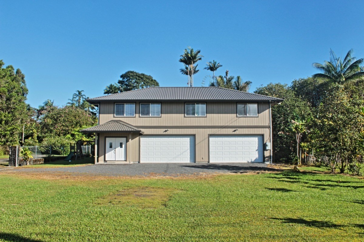 18-1354 Nichols Rd Mountain View Mountain View, HI 96771 - Photo 28 of 30 a front view of a house with a yard