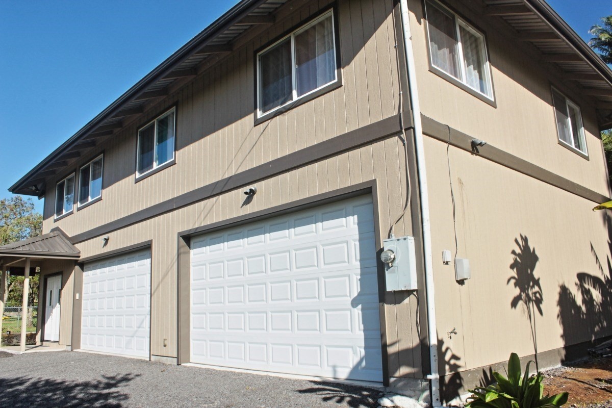 18-1354 Nichols Rd Mountain View Mountain View, HI 96771 - Photo 29 of 30 a front view of a house with a garage