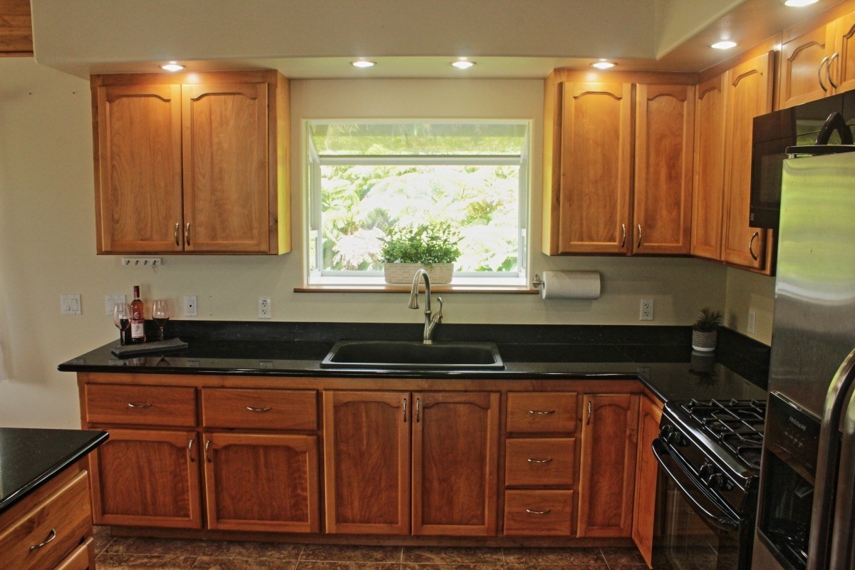 18-1354 Nichols Rd Mountain View Mountain View, HI 96771 - Photo 6 of 30 a kitchen with granite countertop a sink and a stove