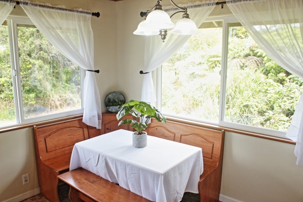 18-1354 Nichols Rd Mountain View Mountain View, HI 96771 - Photo 8 of 30 a view of a dining room with furniture window and outside view