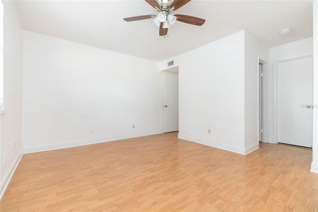 7531 Abonado Road, Unit 1 Tampa, FL 33615 - Photo 13 of 26 an empty room with closet and ceiling fan