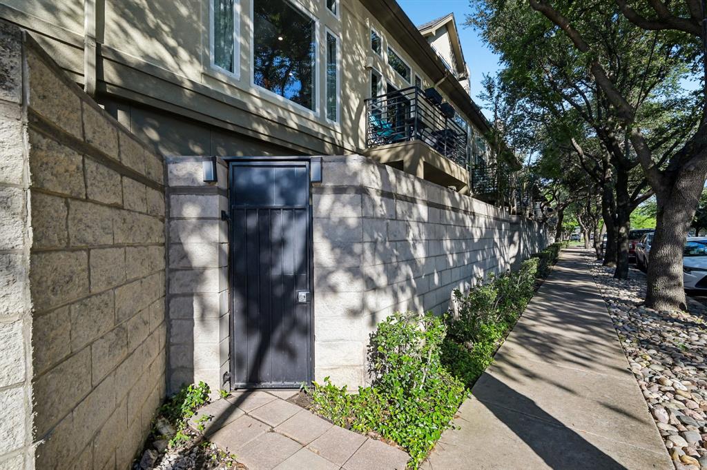 3553 Wheeler Street Dallas, TX 75209 - Photo 31 of 35 Tree-lined streetside exterior of gated West Highland Park townhome community near Oak Lawn and Medical District