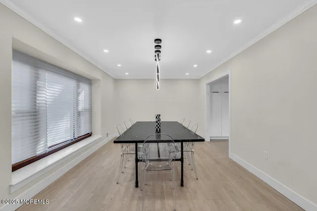 a large kitchen with a table and chairs in it