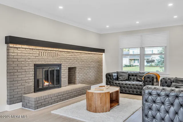 a bedroom with furniture and a fireplace