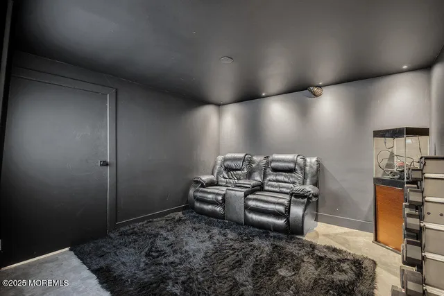 a large bed sitting in a bedroom next to a window