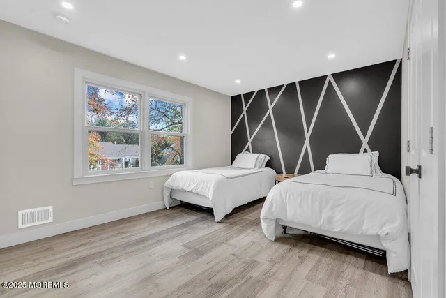 a bedroom with a bed and a ceiling fan