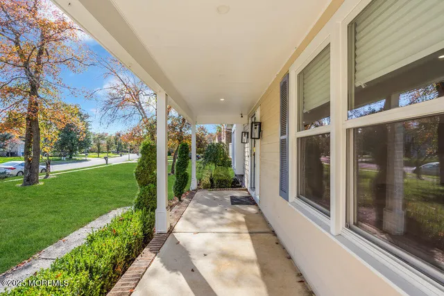 a view of room with stairs and wooden floor