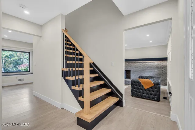 a view of entryway with workspace and stairs