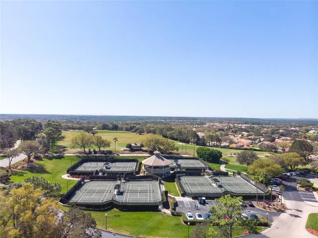 an aerial view of a house with outdoor space