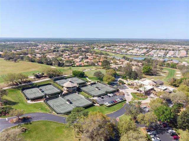 an aerial view of a residential houses with outdoor space