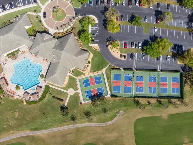 an aerial view of a house with a swimming pool