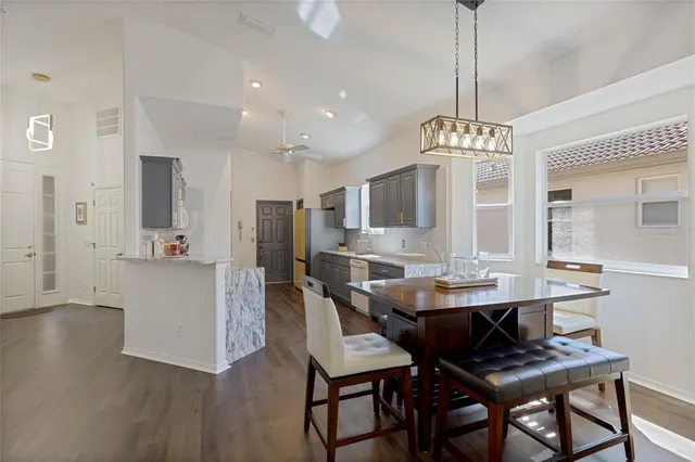 a view of a dining room with furniture wooden floor and chandelier