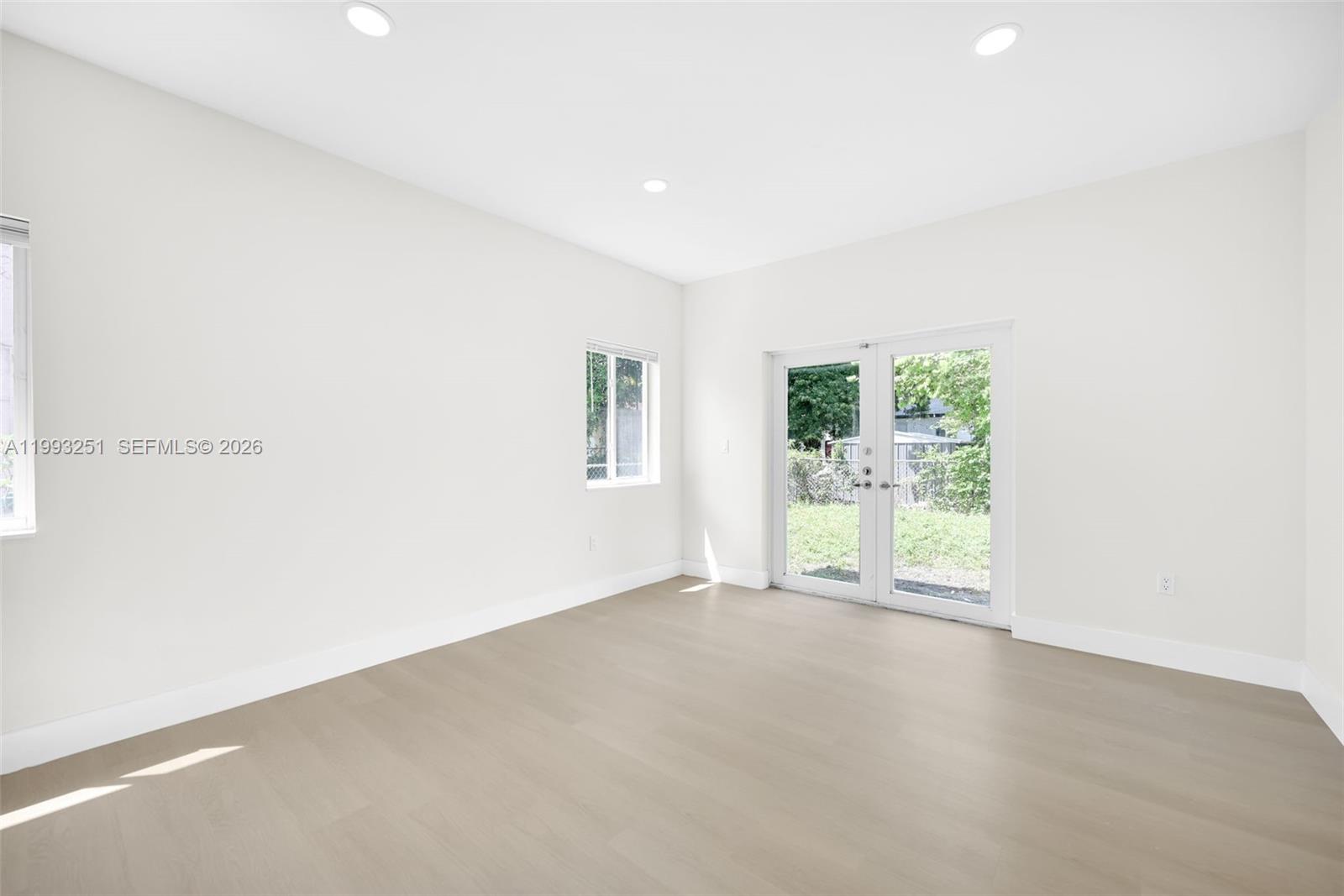 6940 Northwest 5th Place Miami, FL 33150 - Photo 13 of 42 an empty room with windows