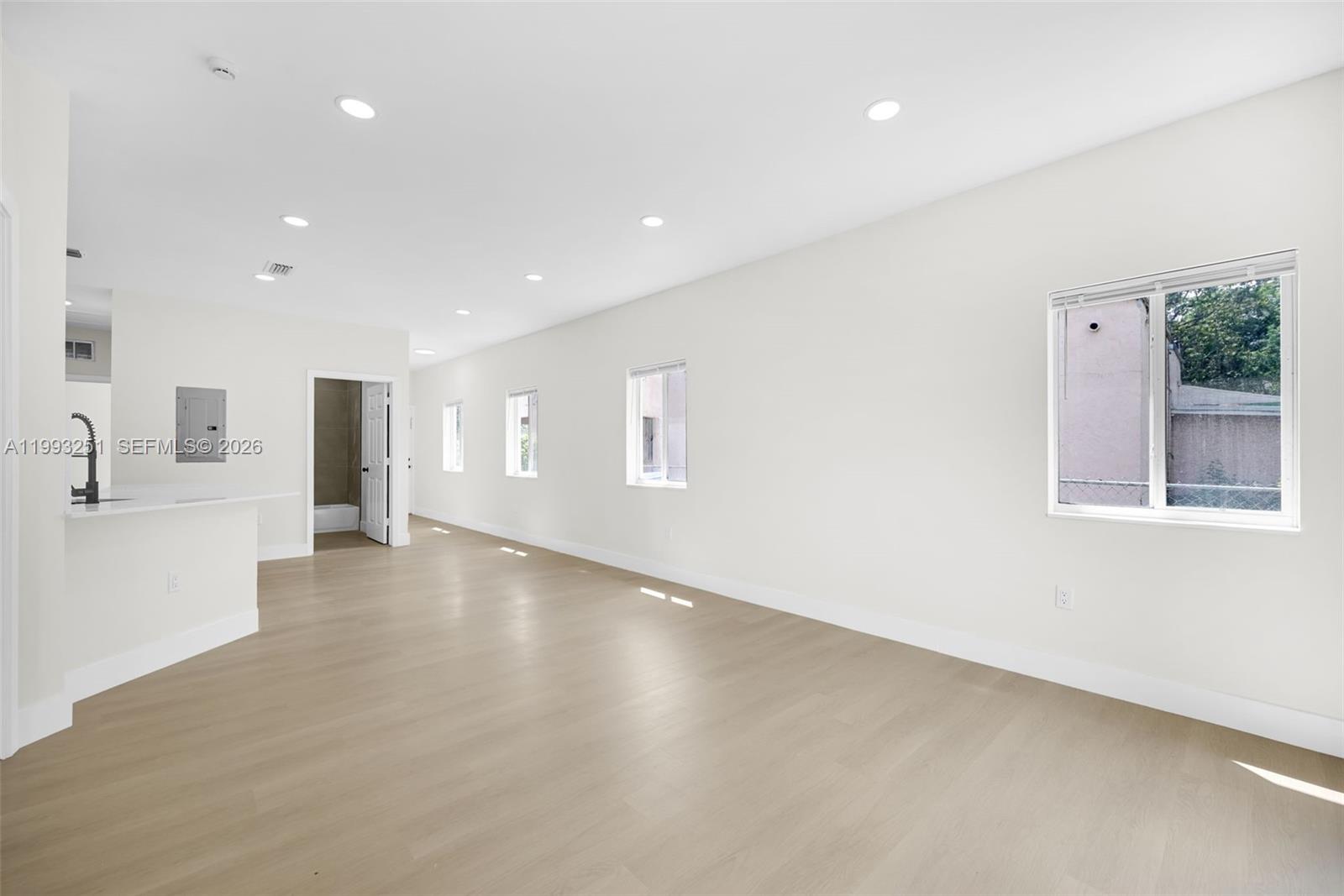 6940 Northwest 5th Place Miami, FL 33150 - Photo 14 of 42 a view of an empty room with a window