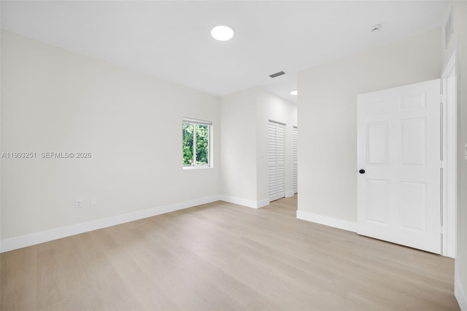 6940 Northwest 5th Place Miami, FL 33150 - Photo 20 of 42 an empty room with windows and closet
