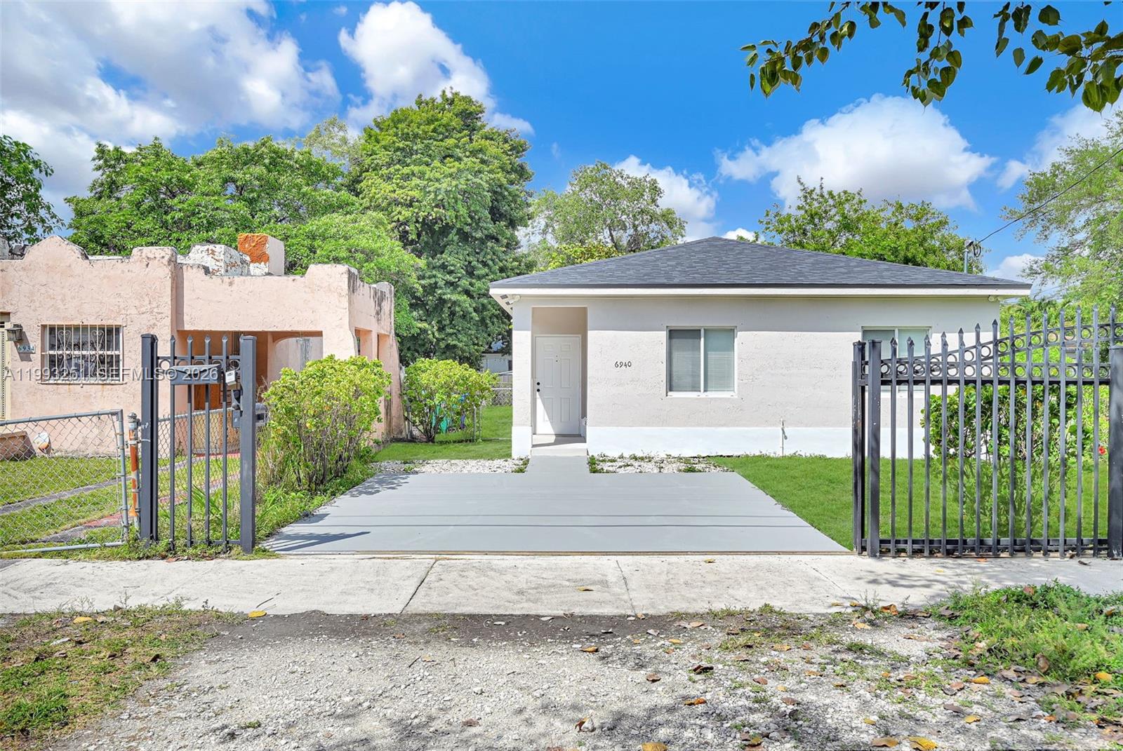 6940 Northwest 5th Place Miami, FL 33150 - Photo 2 of 42 a view of a house with a yard and potted plants
