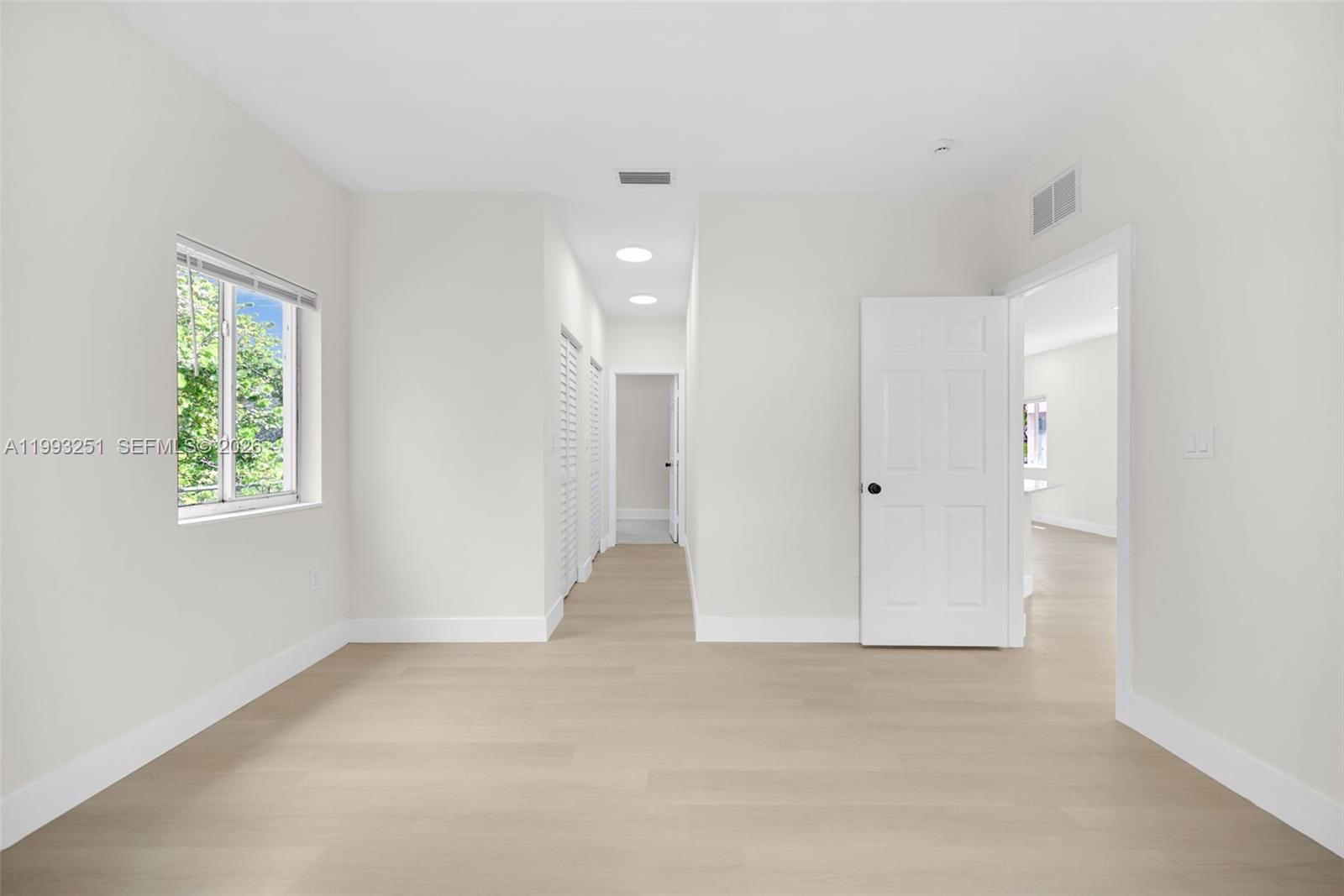 6940 Northwest 5th Place Miami, FL 33150 - Photo 21 of 42 a view of an empty room with a window