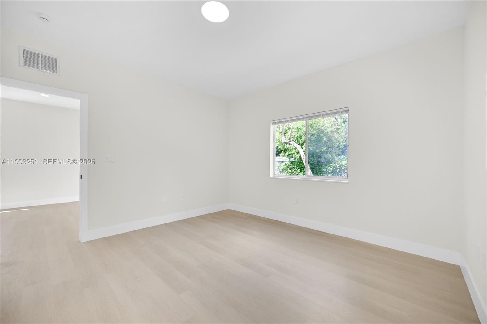 6940 Northwest 5th Place Miami, FL 33150 - Photo 22 of 42 an empty room with windows