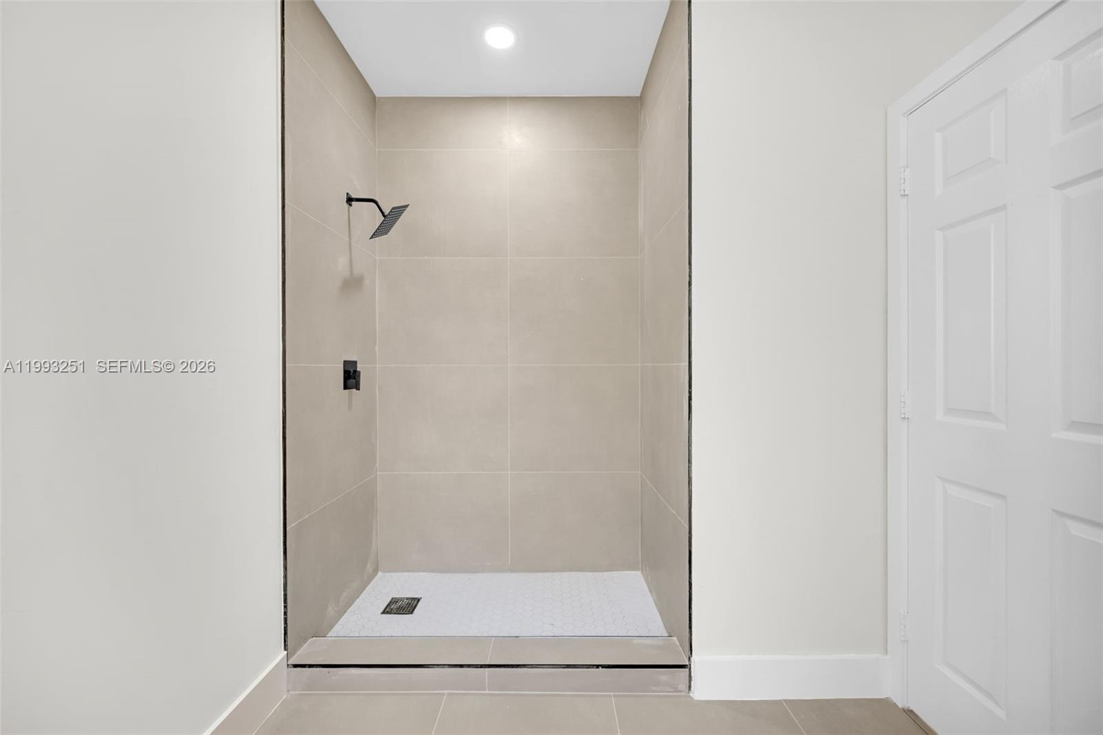 6940 Northwest 5th Place Miami, FL 33150 - Photo 27 of 42 a bathroom with a glass shower door
