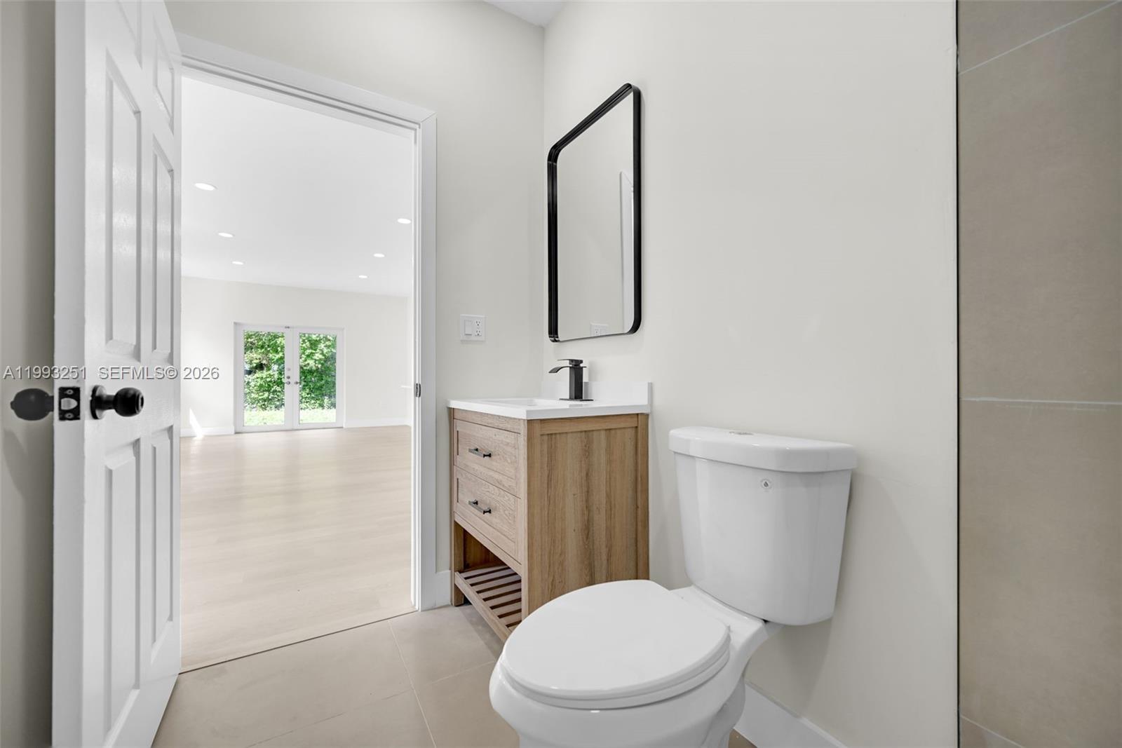6940 Northwest 5th Place Miami, FL 33150 - Photo 35 of 42 a white toilet sitting next to a bathroom sink