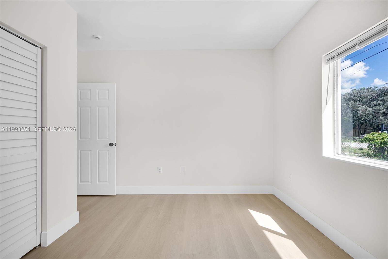 6940 Northwest 5th Place Miami, FL 33150 - Photo 38 of 42 a view of a small space with wooden floor and a window