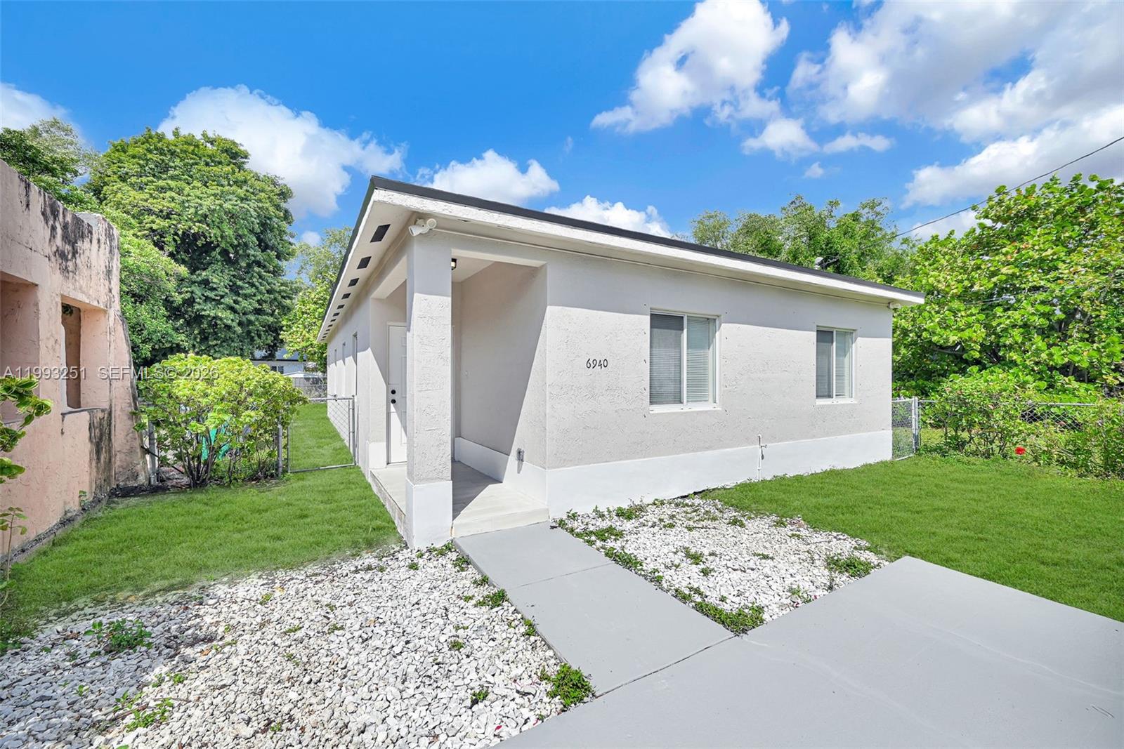 6940 Northwest 5th Place Miami, FL 33150 - Photo 5 of 42 a front view of a house with garden