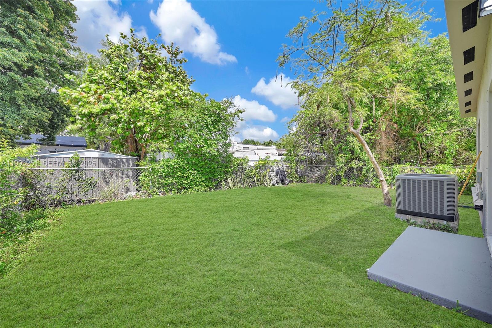 6940 Northwest 5th Place Miami, FL 33150 - Photo 7 of 42 a view of a garden with wooden fence