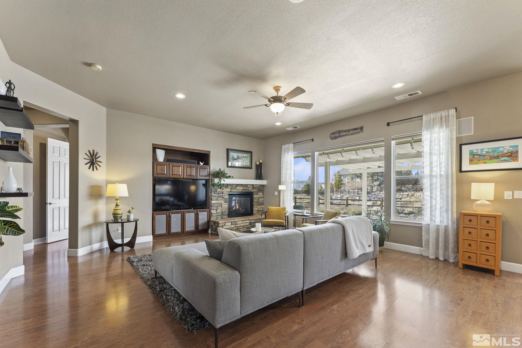 2751 Robb Drive Reno, NV 89523 - Photo 8 of 40 a living room with furniture and a wooden floor