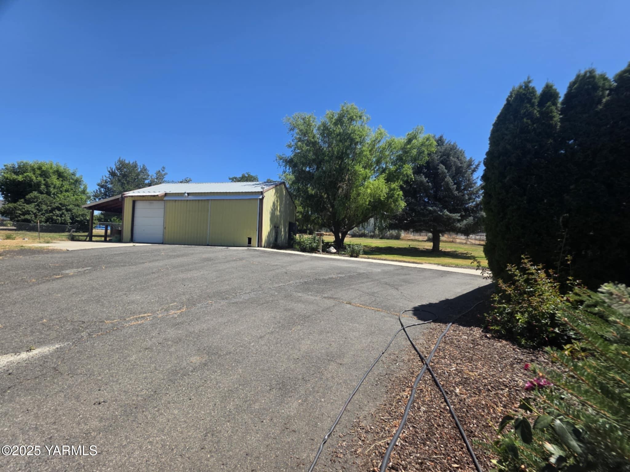 5202 Norman Road Yakima, WA 98901 - Photo 17 of 48 a view of a house with a yard
