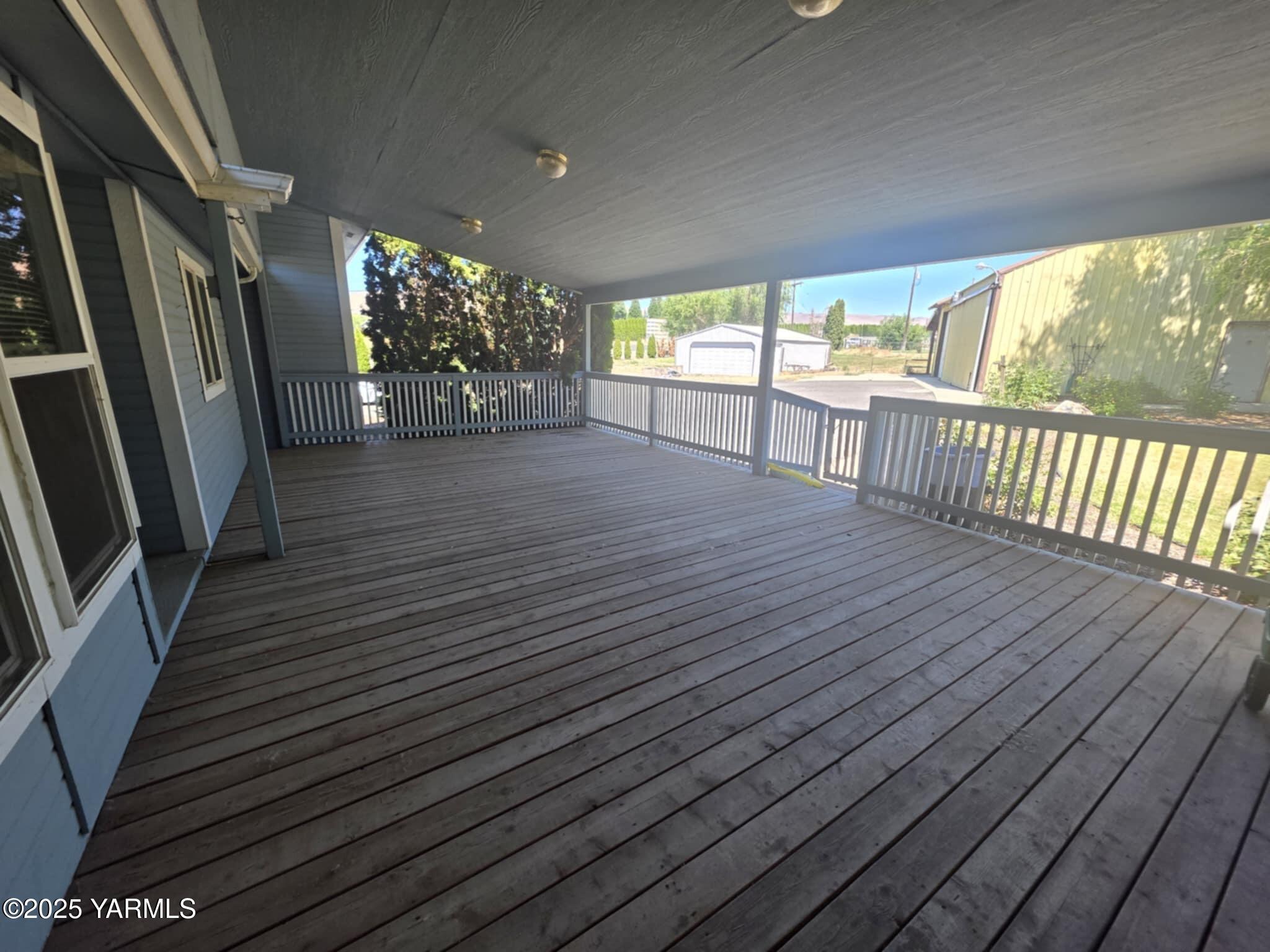 5202 Norman Road Yakima, WA 98901 - Photo 18 of 48 a view of a porch with wooden floor