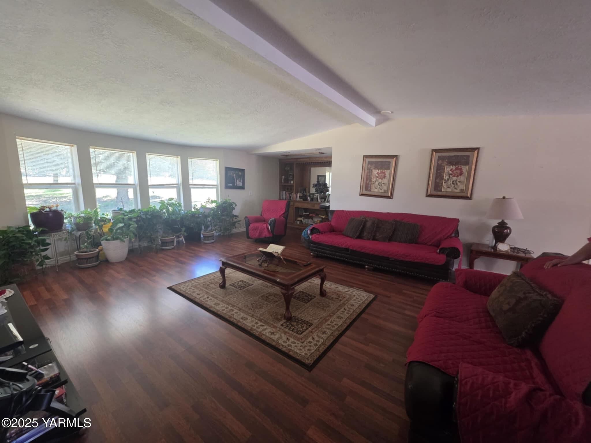 5202 Norman Road Yakima, WA 98901 - Photo 22 of 48 a living room with furniture hard wood floor and a window