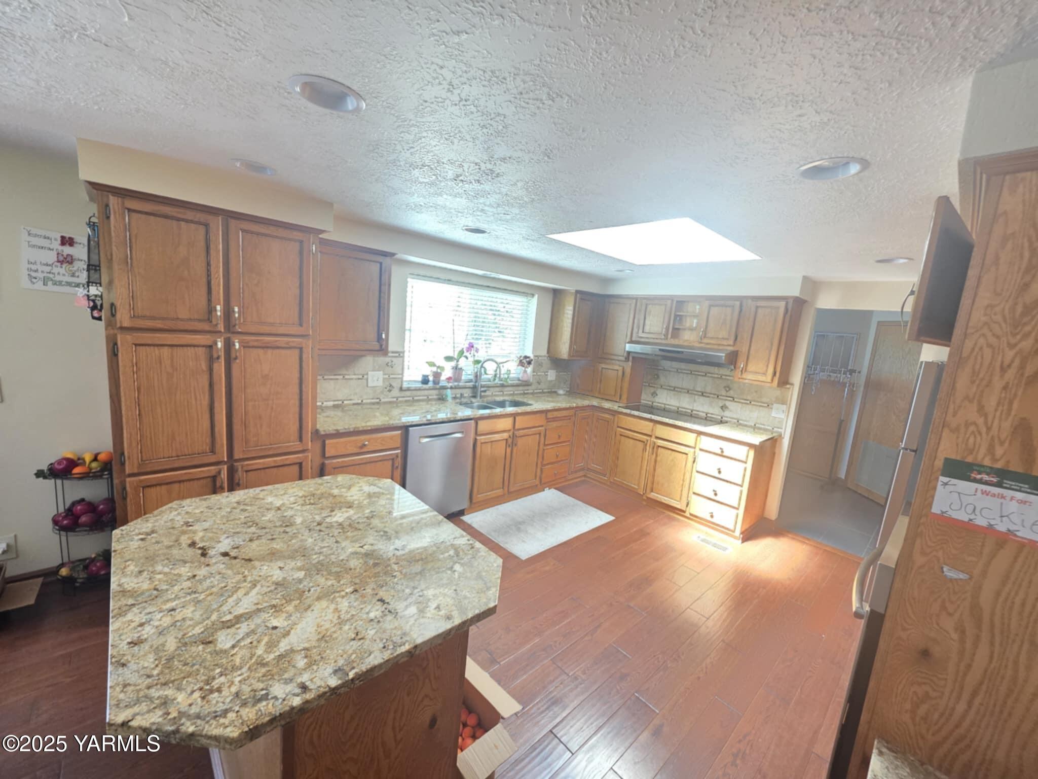 5202 Norman Road Yakima, WA 98901 - Photo 27 of 48 a kitchen with stainless steel appliances granite countertop a sink stove and cabinets