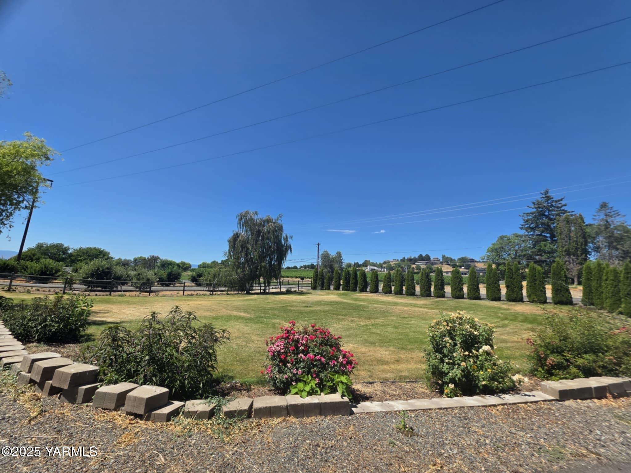 5202 Norman Road Yakima, WA 98901 - Photo 39 of 48 a view of a lake with houses in the back