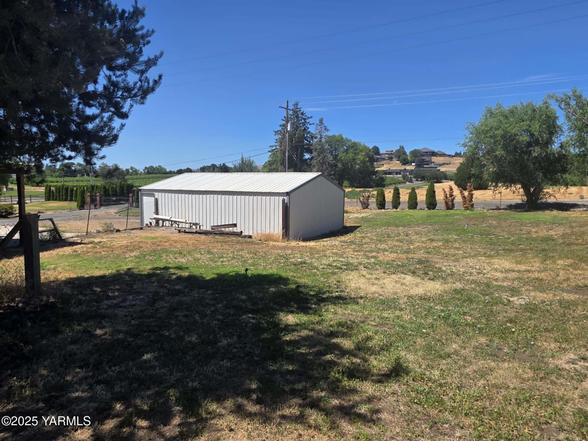 5202 Norman Road Yakima, WA 98901 - Photo 40 of 48 a view of a house with a yard