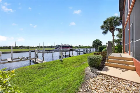 a view of a lake with a table and chairs