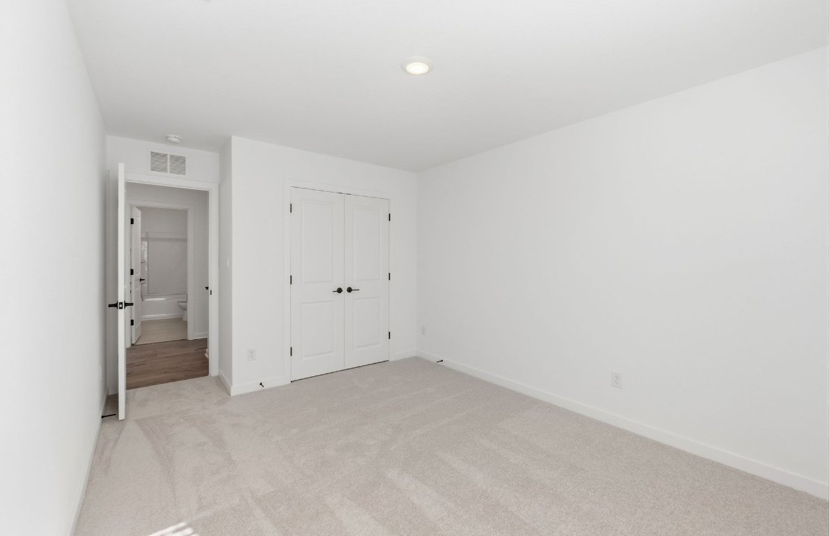 290 Begonia Street Buda, TX 78610 - Photo 17 of 25 an empty room with a bathroom