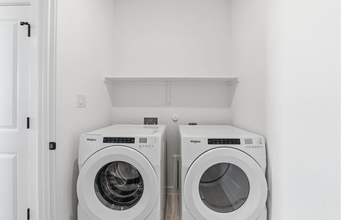 290 Begonia Street Buda, TX 78610 - Photo 19 of 25 a utility room with dryer and washer