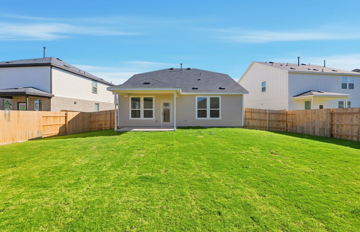 290 Begonia Street Buda, TX 78610 - Photo 20 of 25 front view of a house with a yard