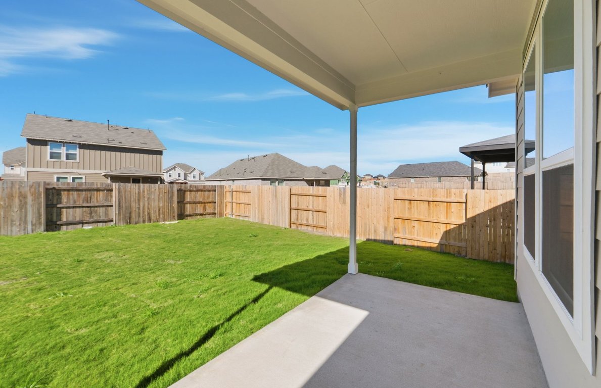 290 Begonia Street Buda, TX 78610 - Photo 21 of 25 a view of a backyard with flat screen tv